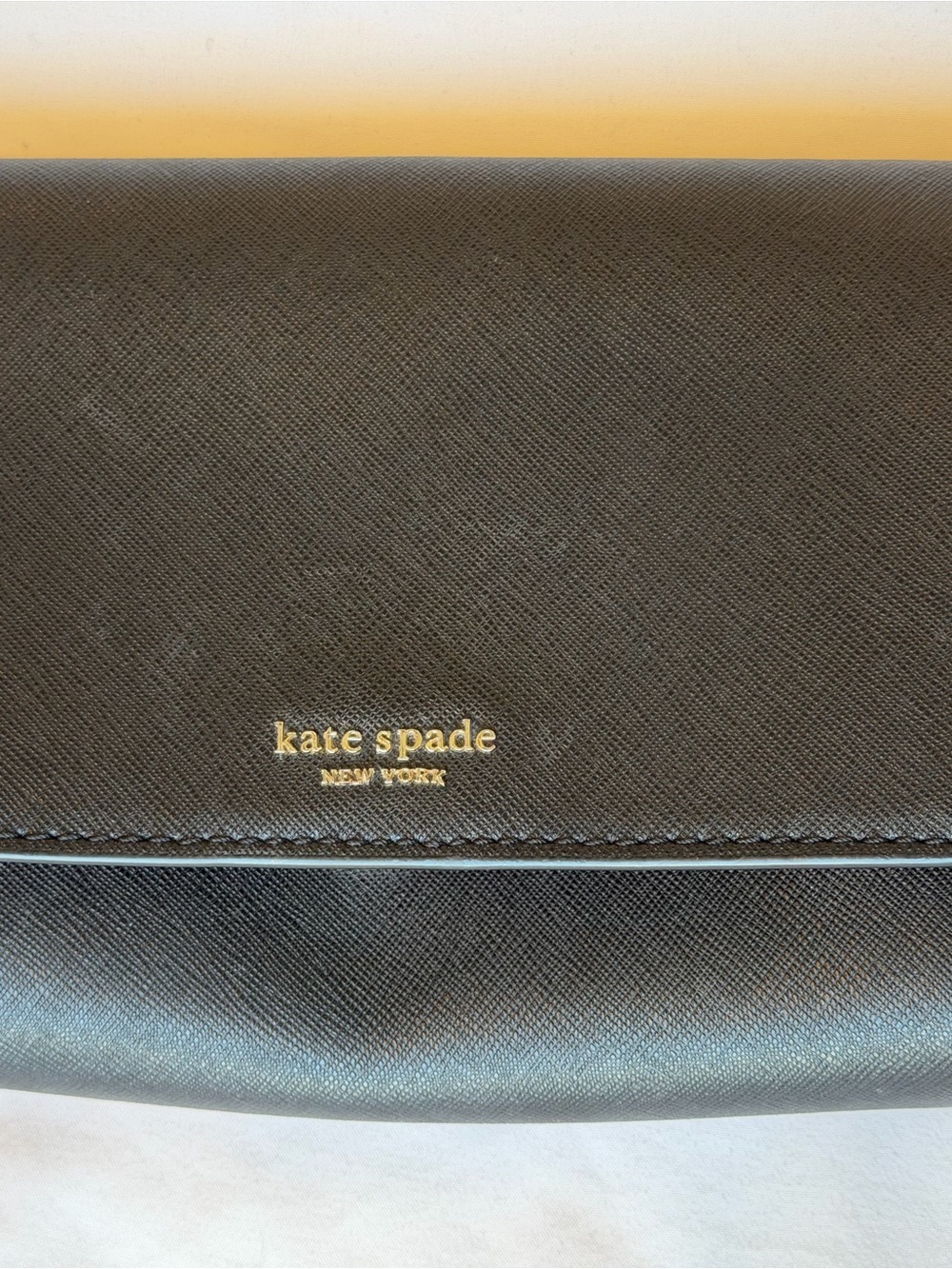 kate spade black leather crossbody with gold logo